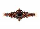 Vintage hinged garnet bangle in Victorian style with Vienna engraving
