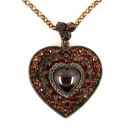 Vintage garnet cabouchon heart locket in Victorian style