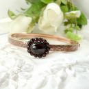 # Vintage garnet bangle with an oval center stone